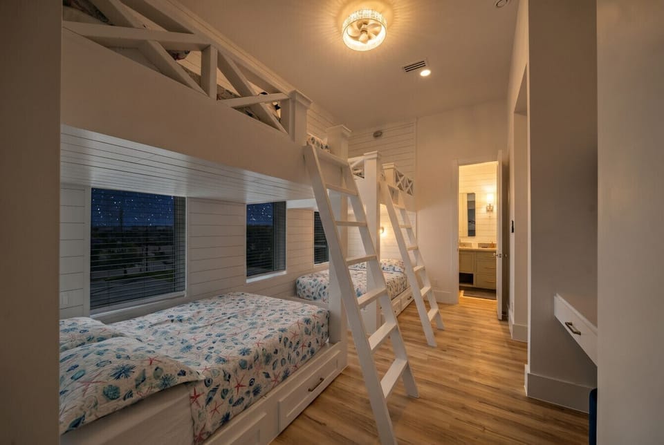 This bedroom has two twin-over-twin bunk beds