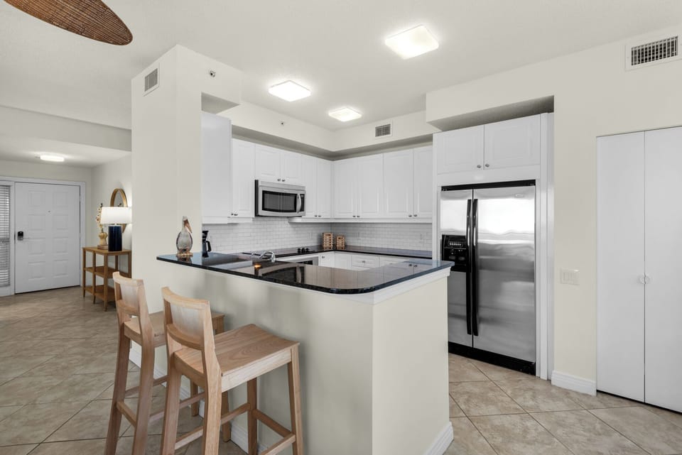 Kitchen with Bar Seating, Pantry and Foyer