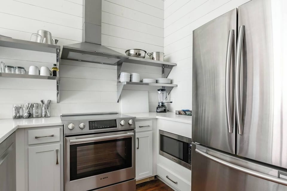 Fully equipped kitchen with modern appliances.