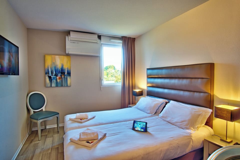 Stretch out in a bright room with AC and TV.