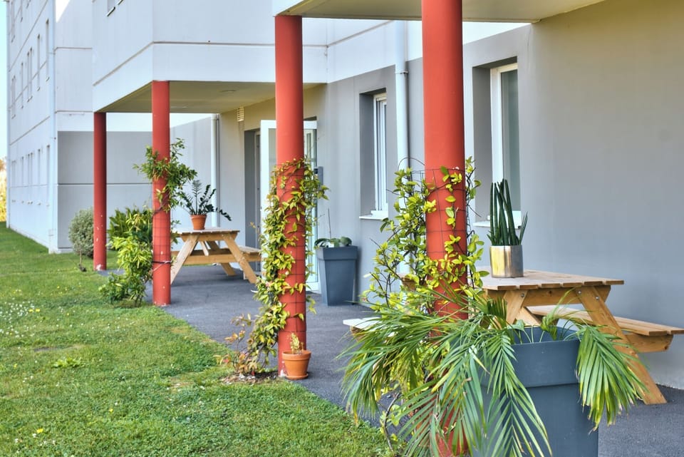 Unwind outdoors with coffee at shaded picnic tables.