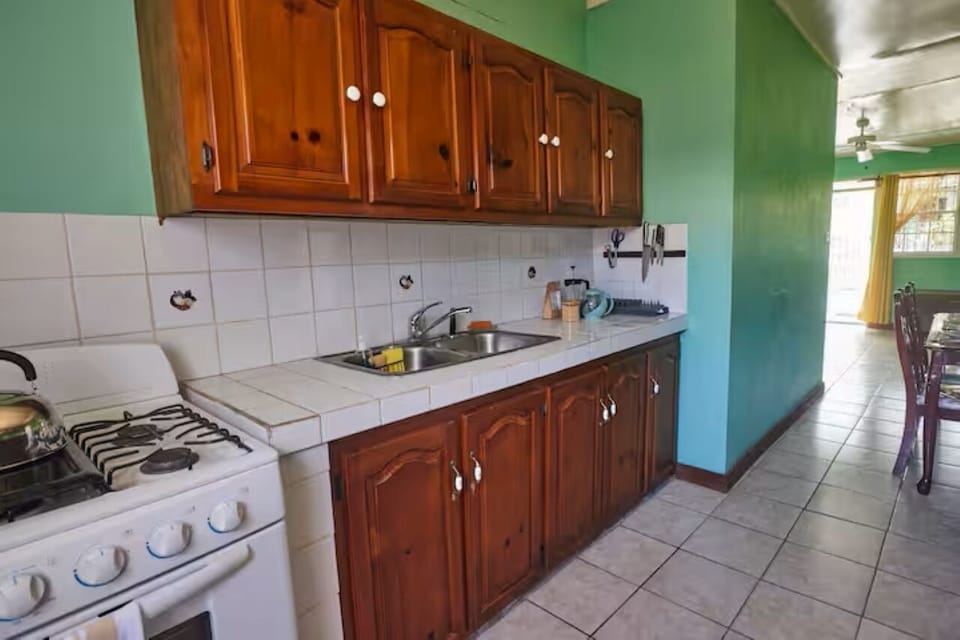 A practical kitchen with cooking essentials and plenty of storage space.