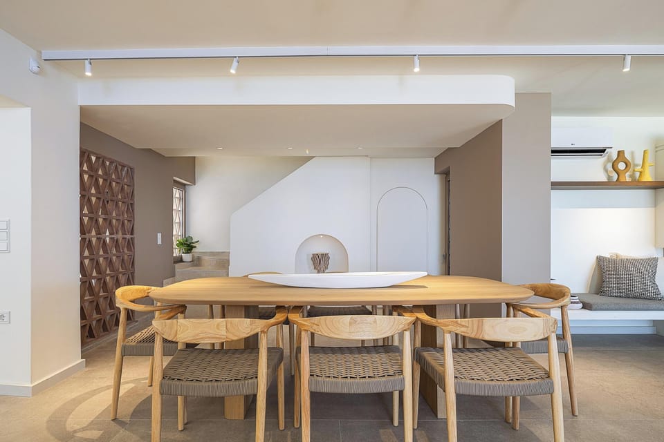 Adjacent to it is the dining area, comfortably seating up to ten guests