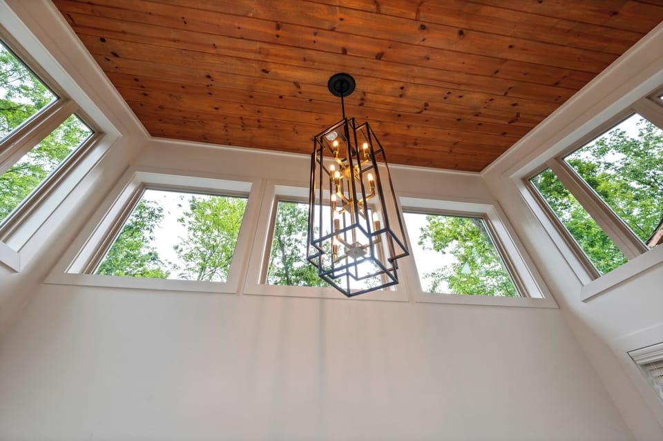Skylight with wood ceiling brings natural light throughout the cabin - built August 2025, treehouse vibes with modern comfort