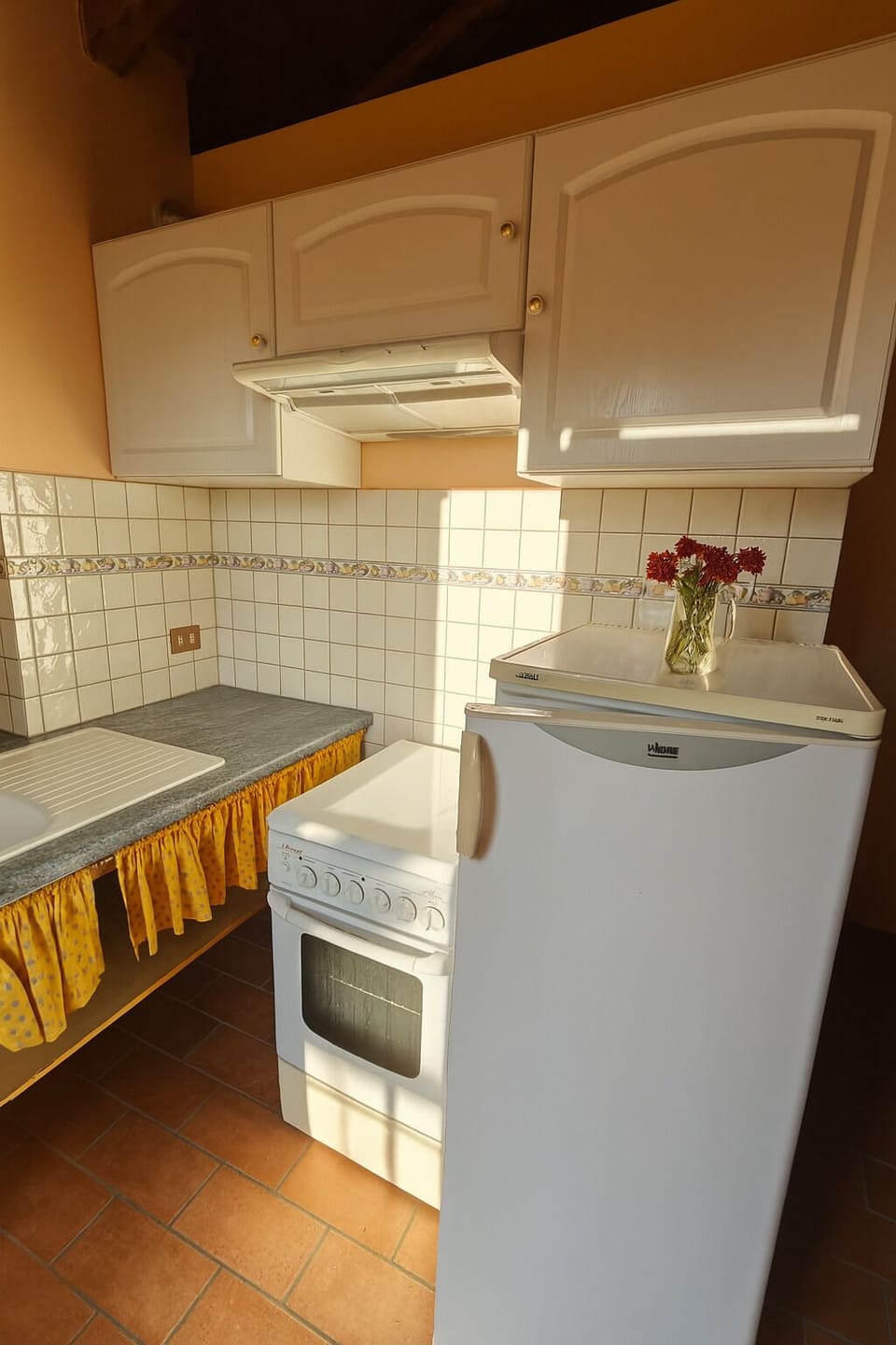 Kitchenette fridge, freezer, oven, hob and storage