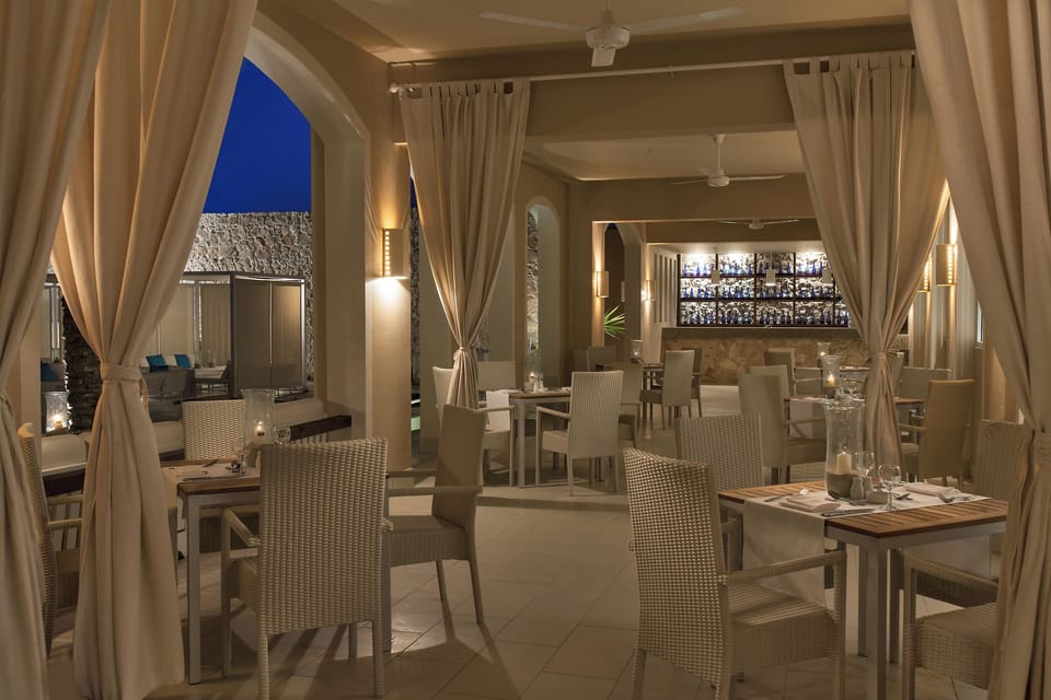 Sip cocktails in an elegant lounge with soft evening ambiance.