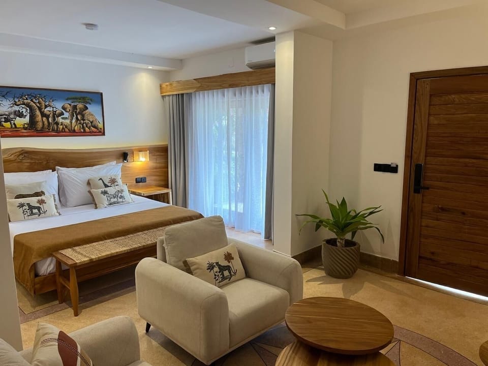 Unwind in a serene suite with cozy lounge seating.