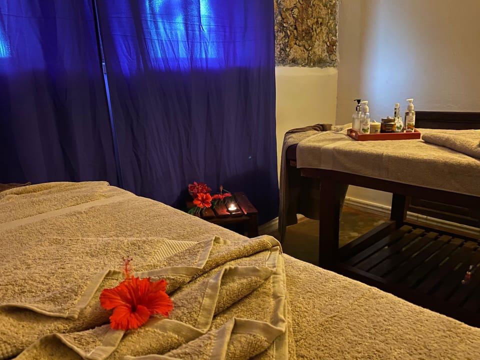 Unwind with soothing massages in a candlelit, serene room.