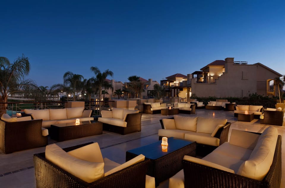 Sip sunset cocktails on a chic rooftop lounge terrace.