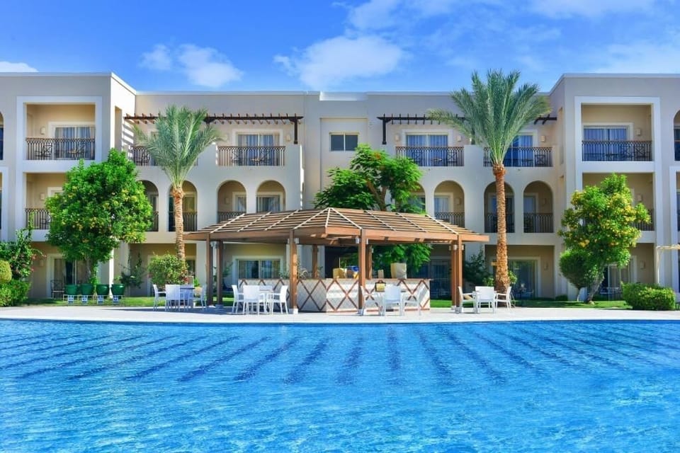 Sip something refreshing at the poolside bar, steps from water.