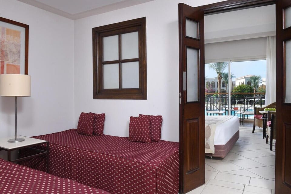 Unwind in a cozy twin room after sunny pool days.