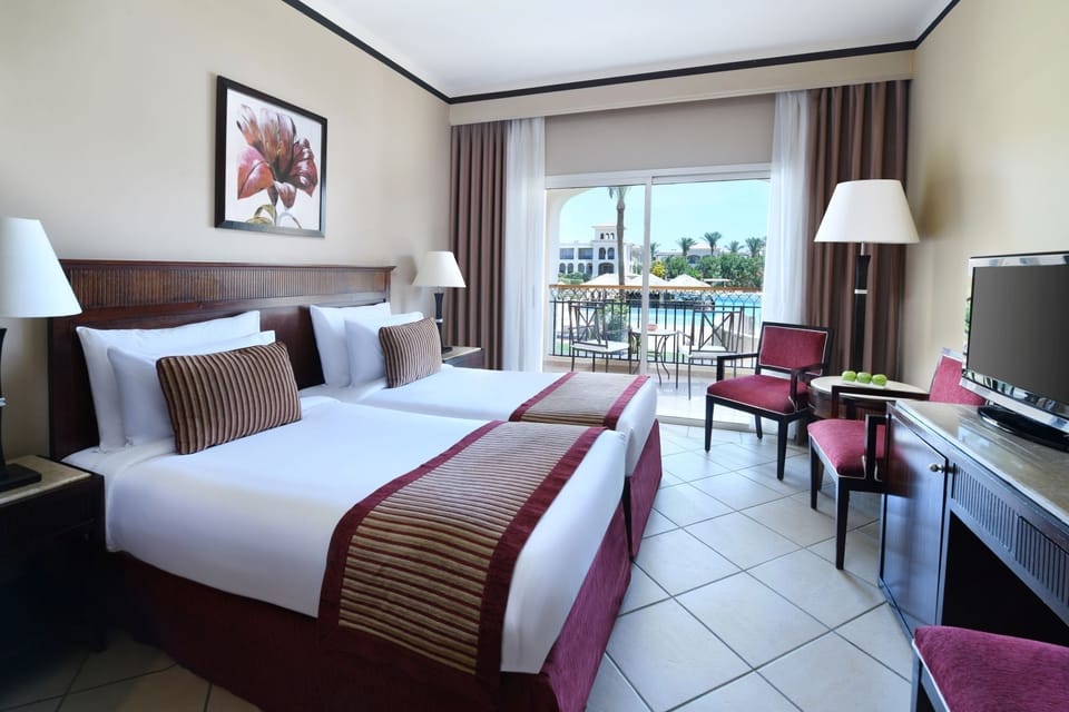 Wake up to balcony breezes and sparkling pool views.