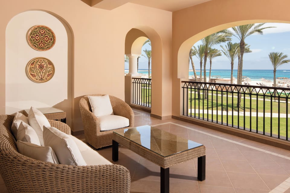 Sip morning coffee as ocean breezes drift through the arches.