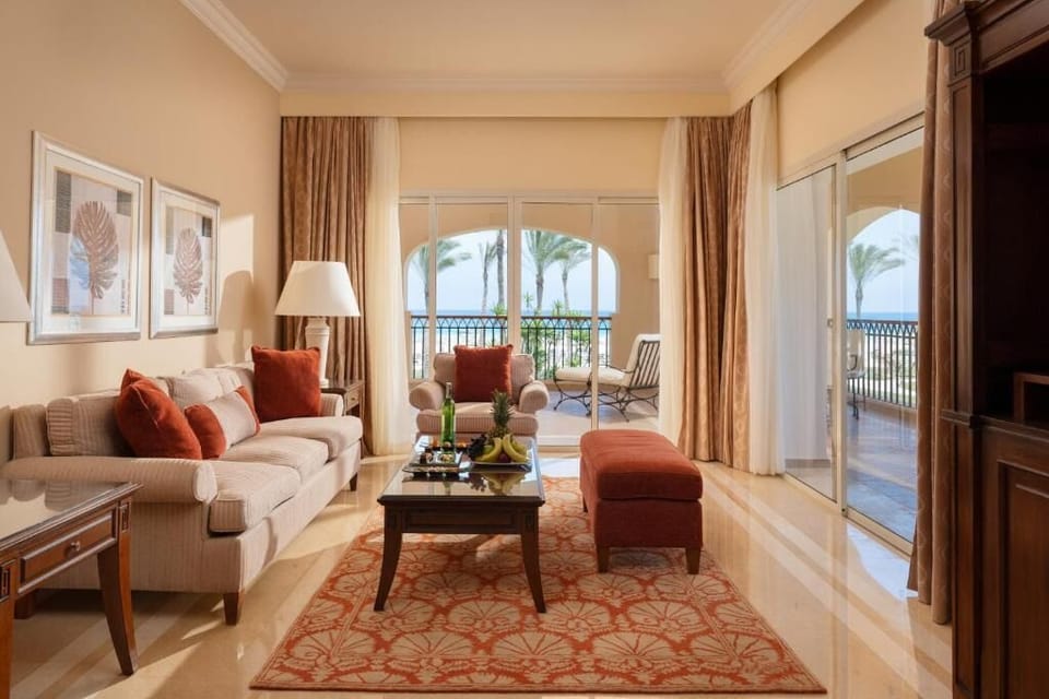 Unwind on plush sofas with sweeping sea-view sunshine.