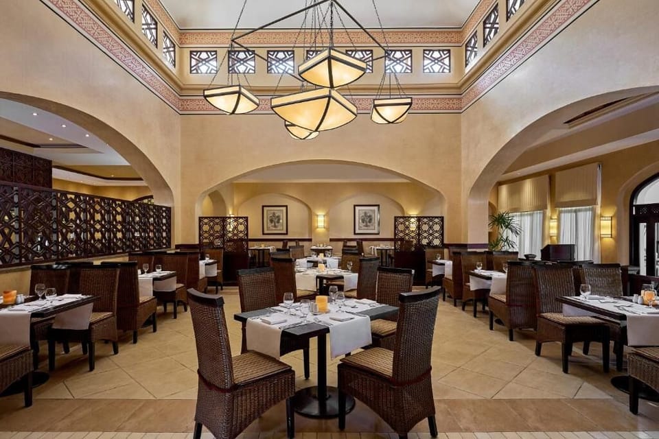 Savor elegant dinners beneath soaring ceilings and soft lighting.
