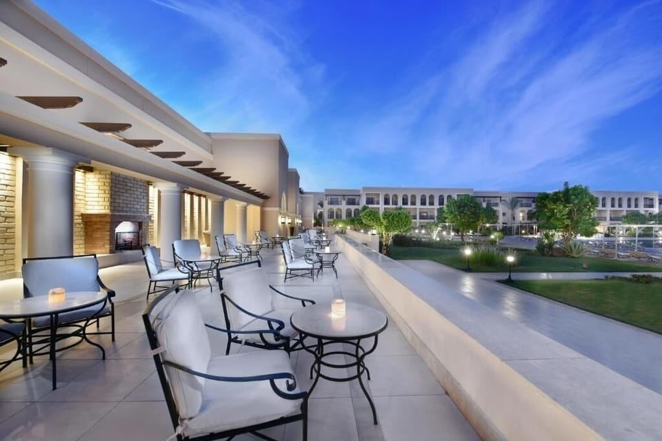 Sip cocktails on the terrace as the sky turns blue.