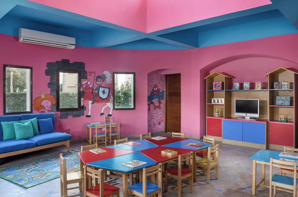 Gather for games and crafts in the cheerful kids club.