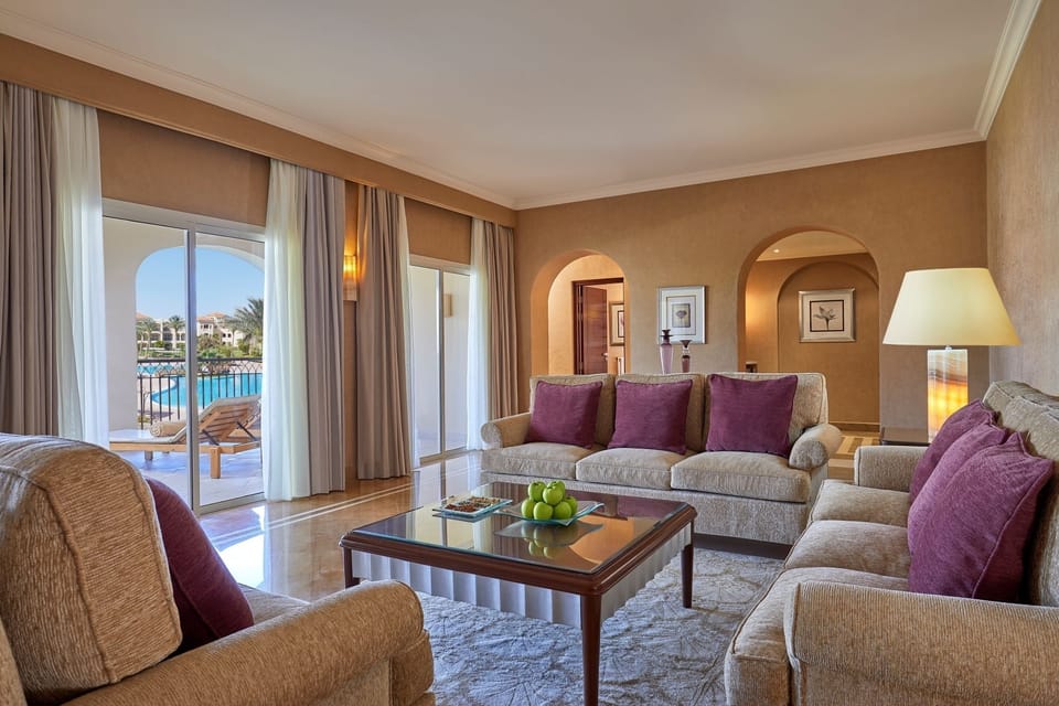 Gather for sunset drinks with pool views and plush seating.