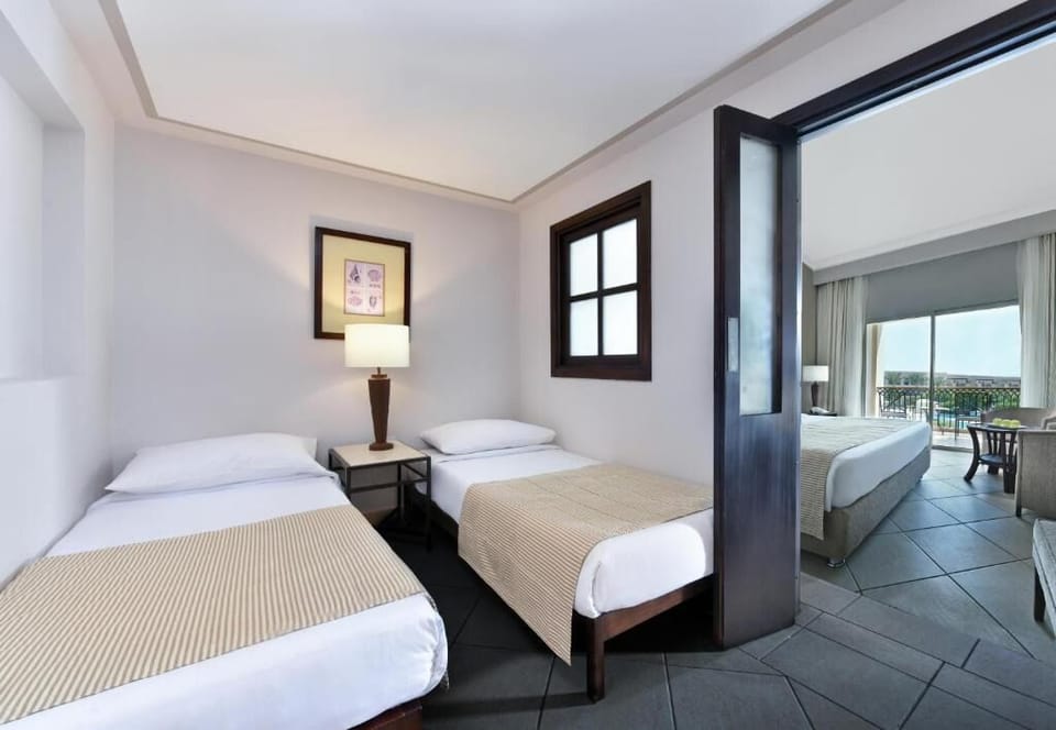 Recharge in a cozy twin room with soft linens.