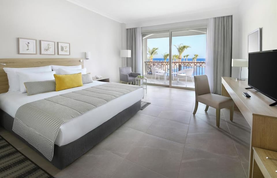 Stretch out in a spacious room with breezy balcony outlooks.