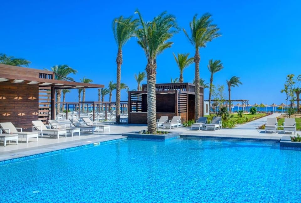 Dive into crystal-blue water and lounge under swaying palms.