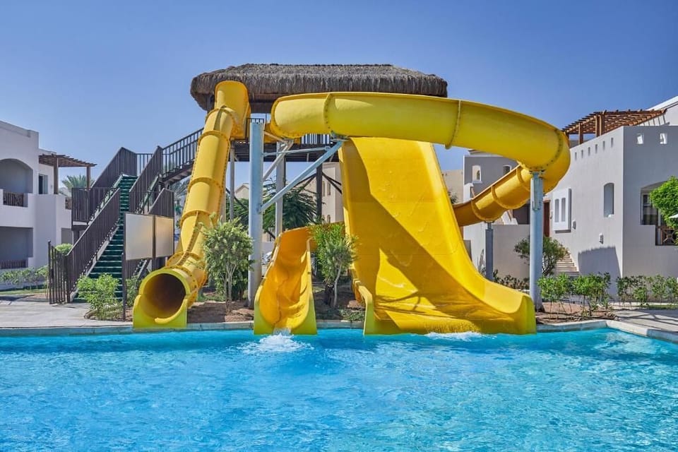 Splash into vacation fun with thrilling waterslides and sparkling pool.