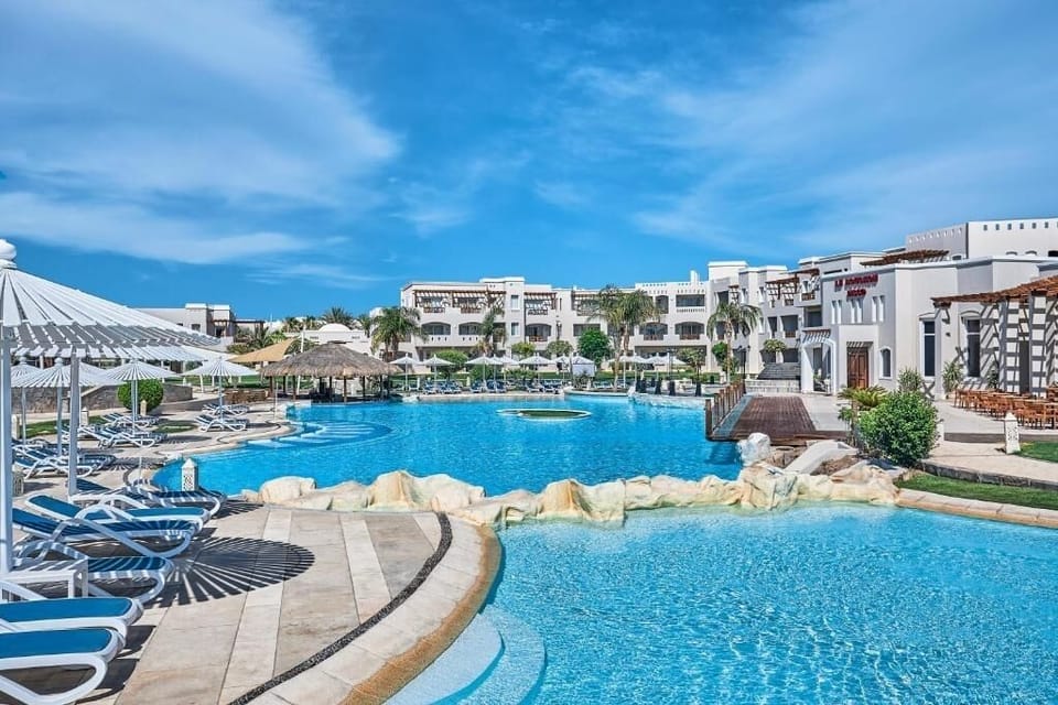 Soak up sunshine beside the sparkling pool and loungers.