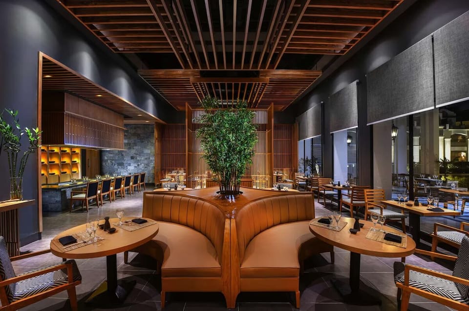 Gather for an intimate dinner in a moody, modern space.
