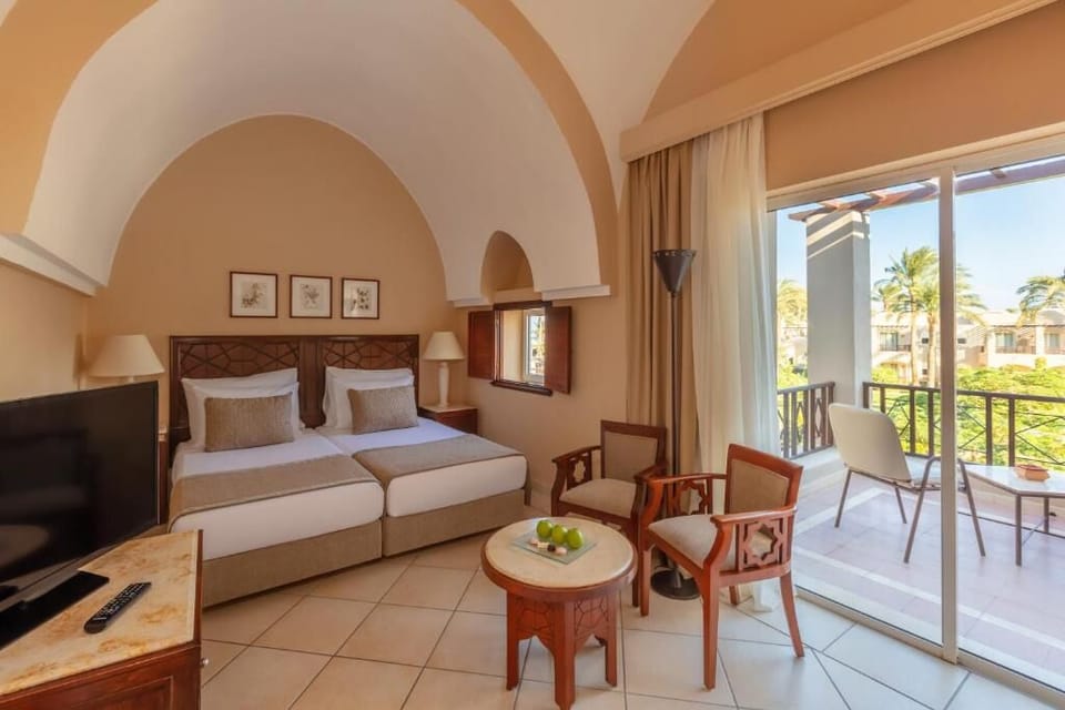 Unwind in airy twin beds with balcony garden views.