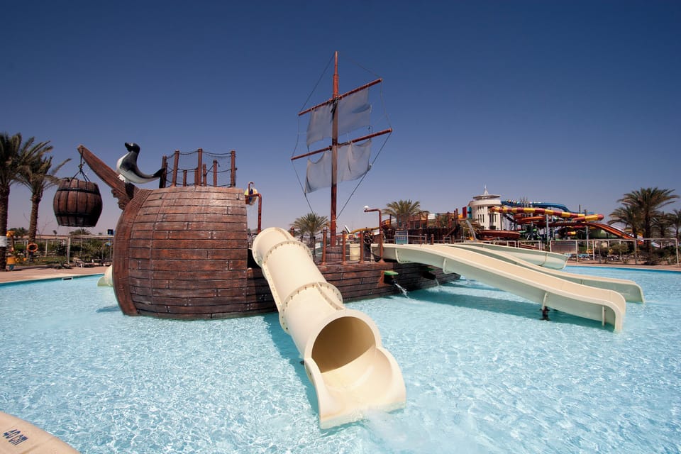Soak up poolside fun beside the iconic pirate ship.