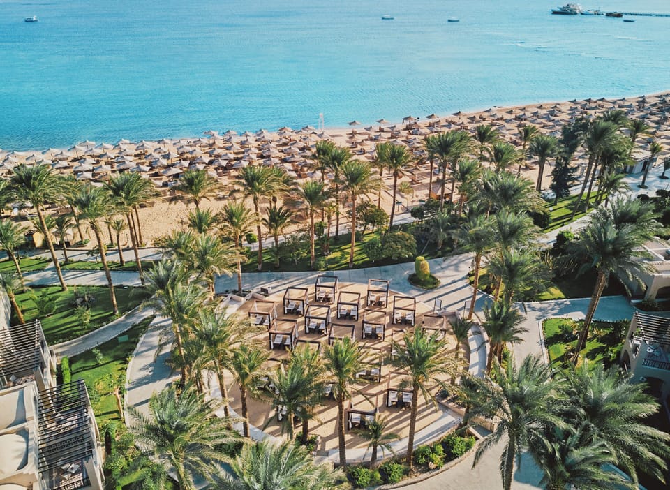 Stroll through lush gardens straight to the sun-drenched beach.