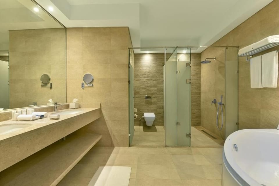 Refresh in a spa-like bath with tub and rainfall shower.