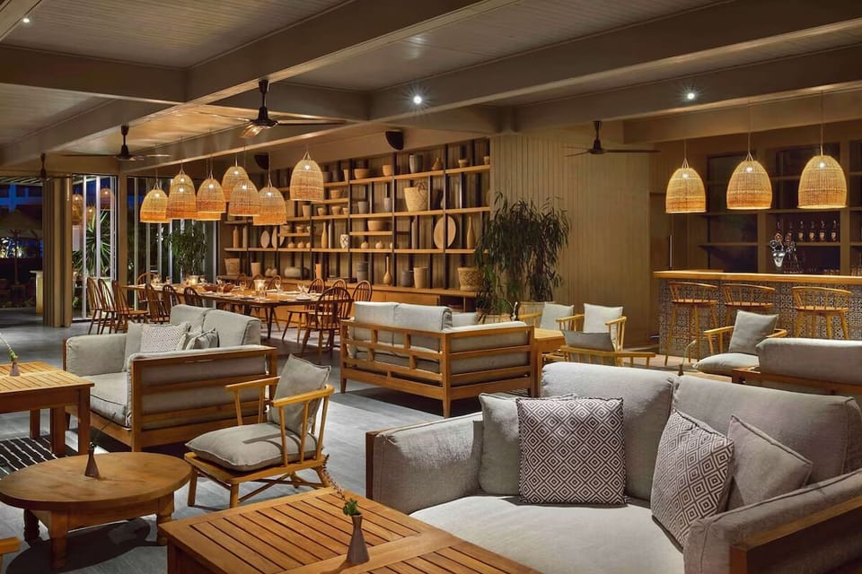 Settle into a chic bar lounge with warm evening lighting.