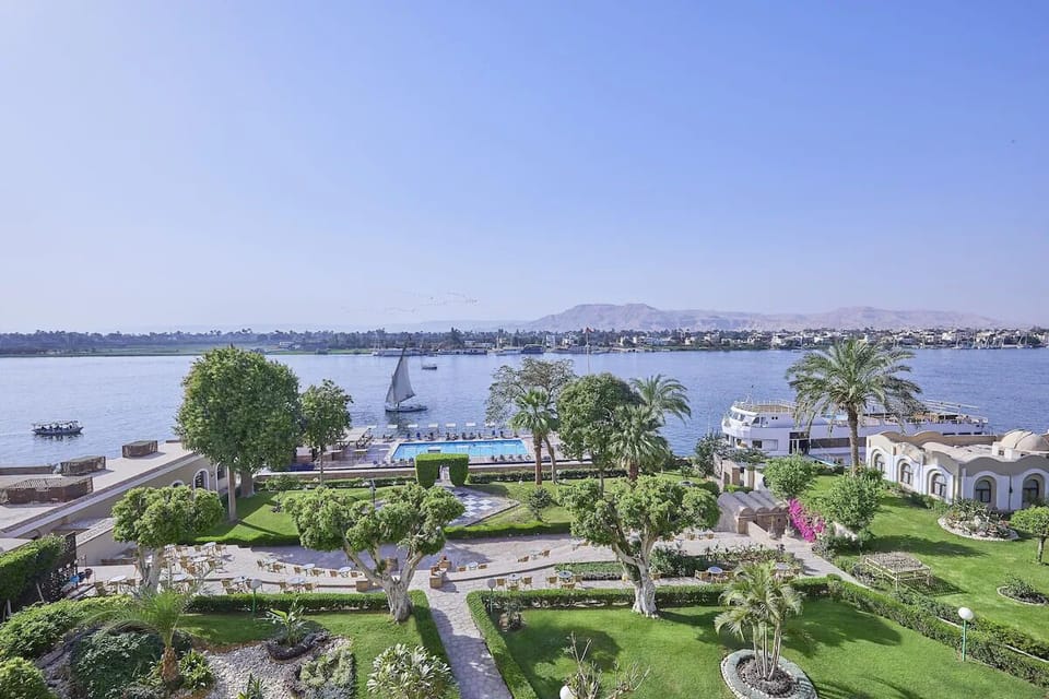 Wander through manicured gardens framed by tranquil river scenery.