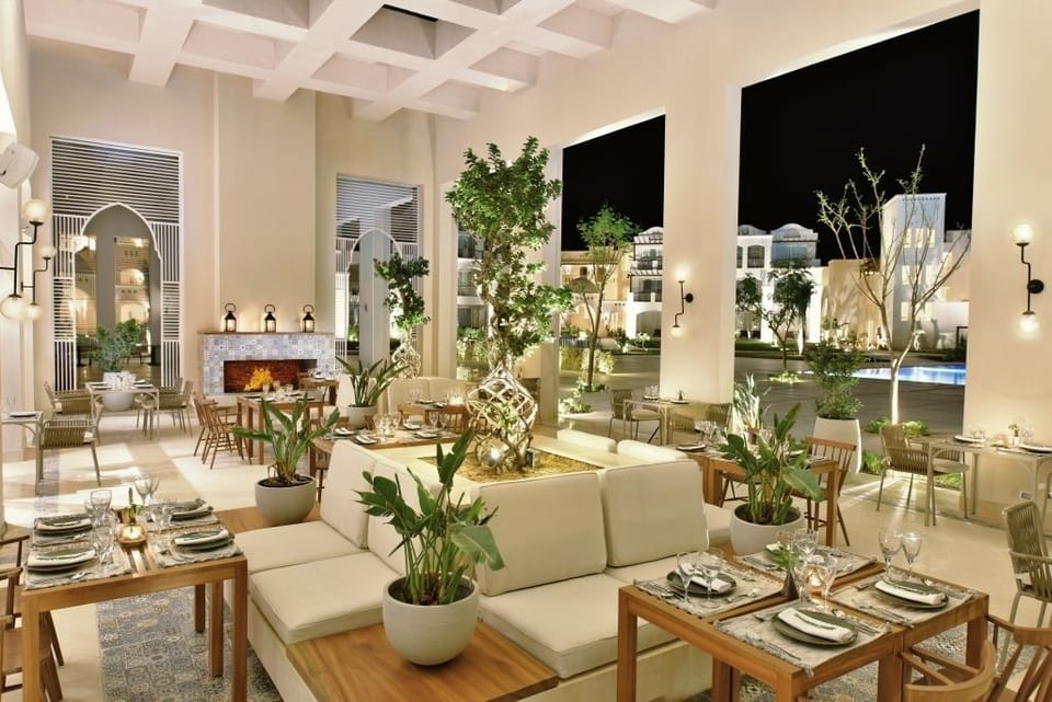 Unwind under warm lights in a serene open-air lounge.
