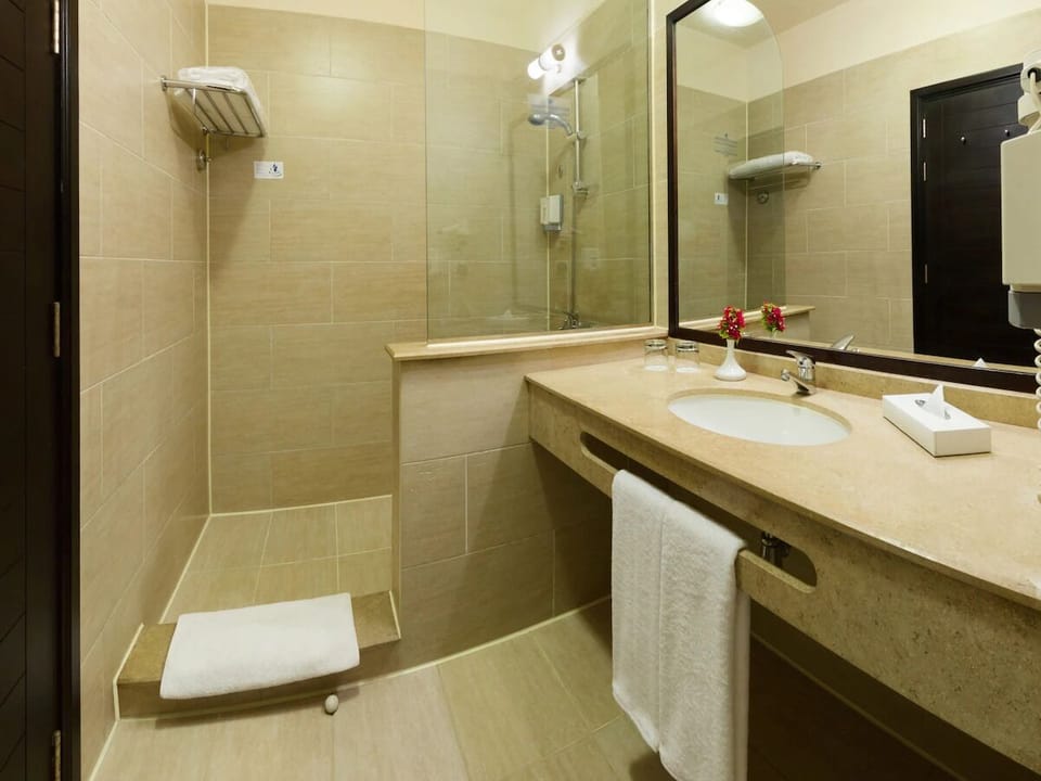 Refresh under a spacious walk-in shower after beach days.