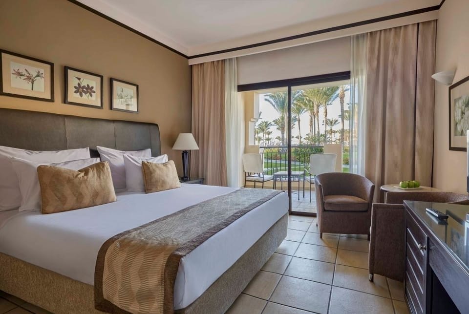 Settle into a bright room with seating by the balcony.