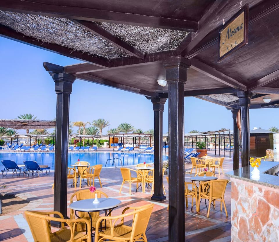 Sip refreshing drinks poolside while soaking up the sunshine.