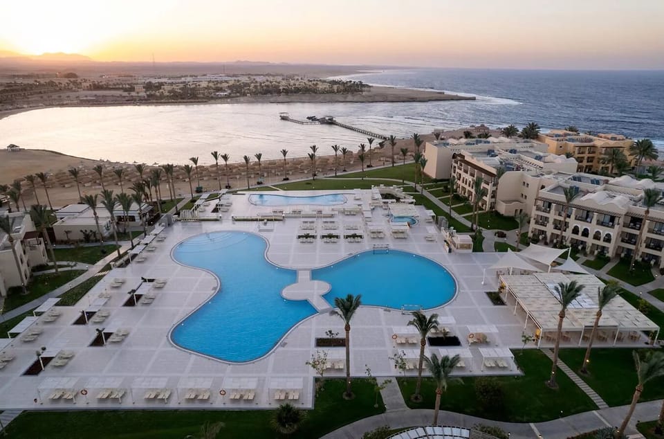 Dive into resort-scale pools with sweeping sea views.