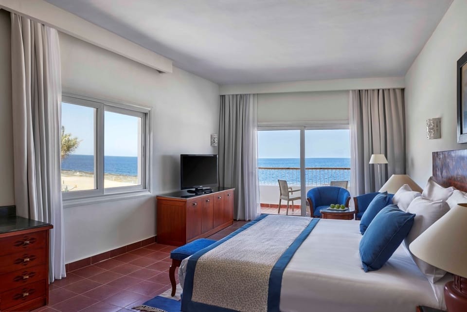 Stretch out with friends and enjoy the bright seaside balcony.