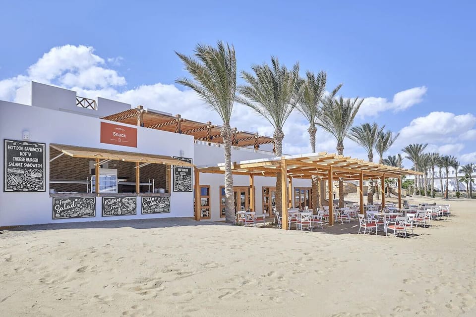 Stretch out with friends and enjoy the bright seaside balcony.