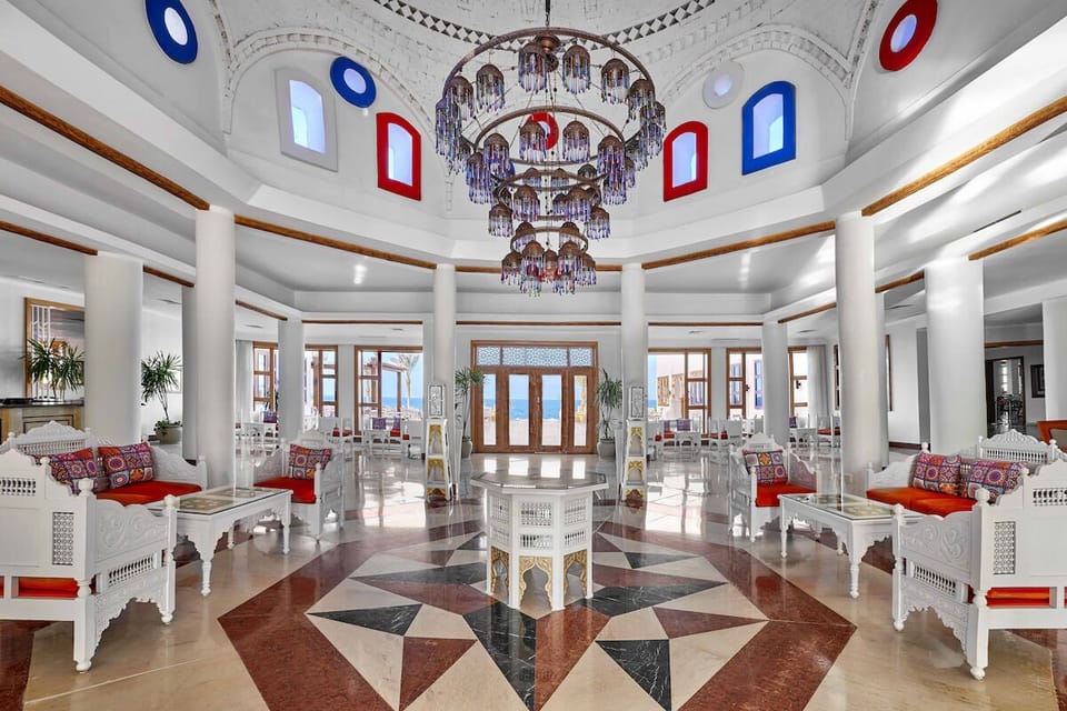 Step into a soaring lobby crowned by dazzling chandeliers.
