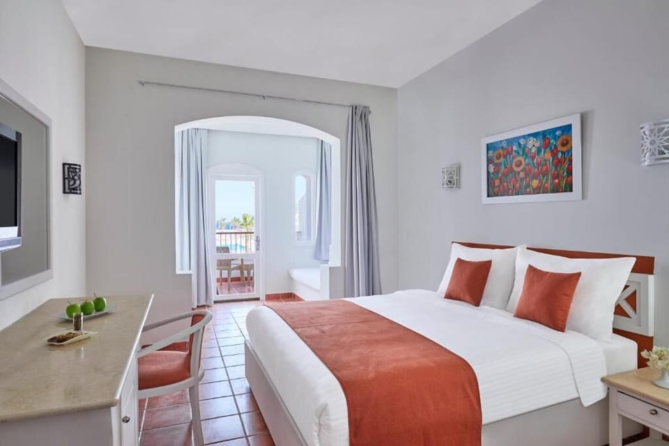Wake up to soft light and breezy balcony views.