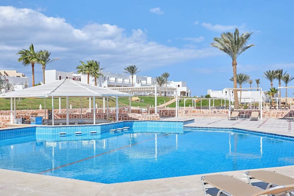 Dive into sparkling water, then lounge in breezy shade.