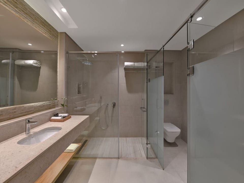 Refresh in a sleek walk-in shower with spa calm.