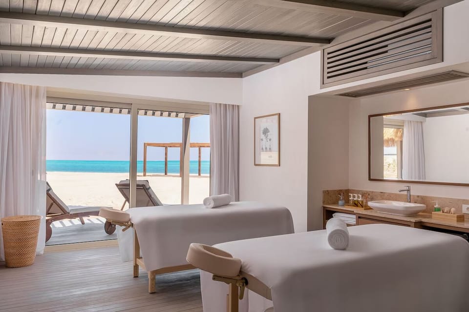 Indulge side-by-side treatments in a bright, calming spa suite.
