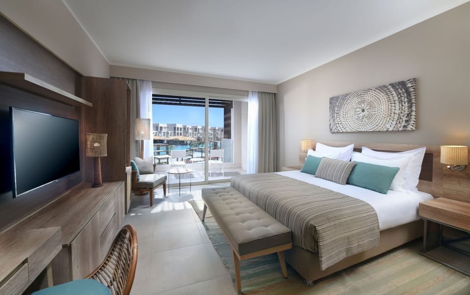 Unwind in a serene bedroom with balcony breeze.
