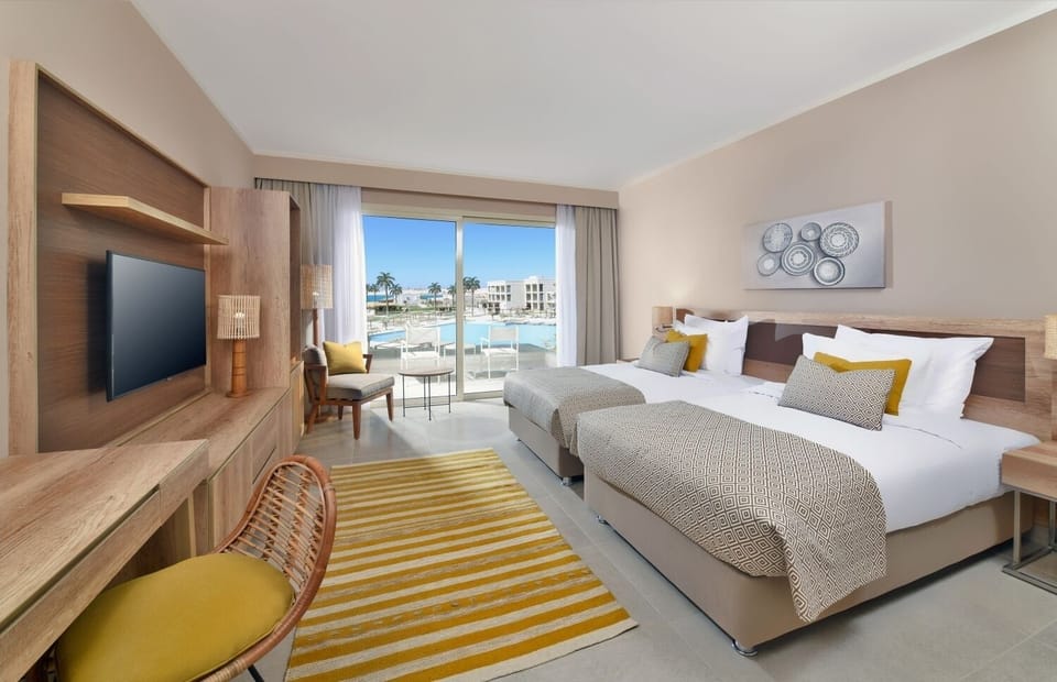 Wake up to sunshine and pool views from bed.