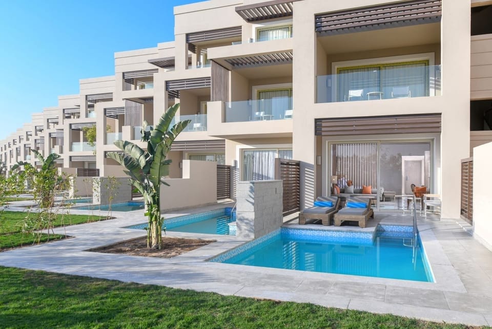 Sip coffee as ocean-blue horizons frame your private terrace.