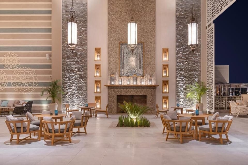 Linger by the fireplace in a tranquil, lantern-lit lounge.